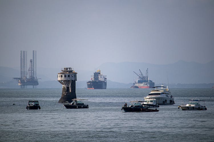 Oil Refinery And A Lighthouse 