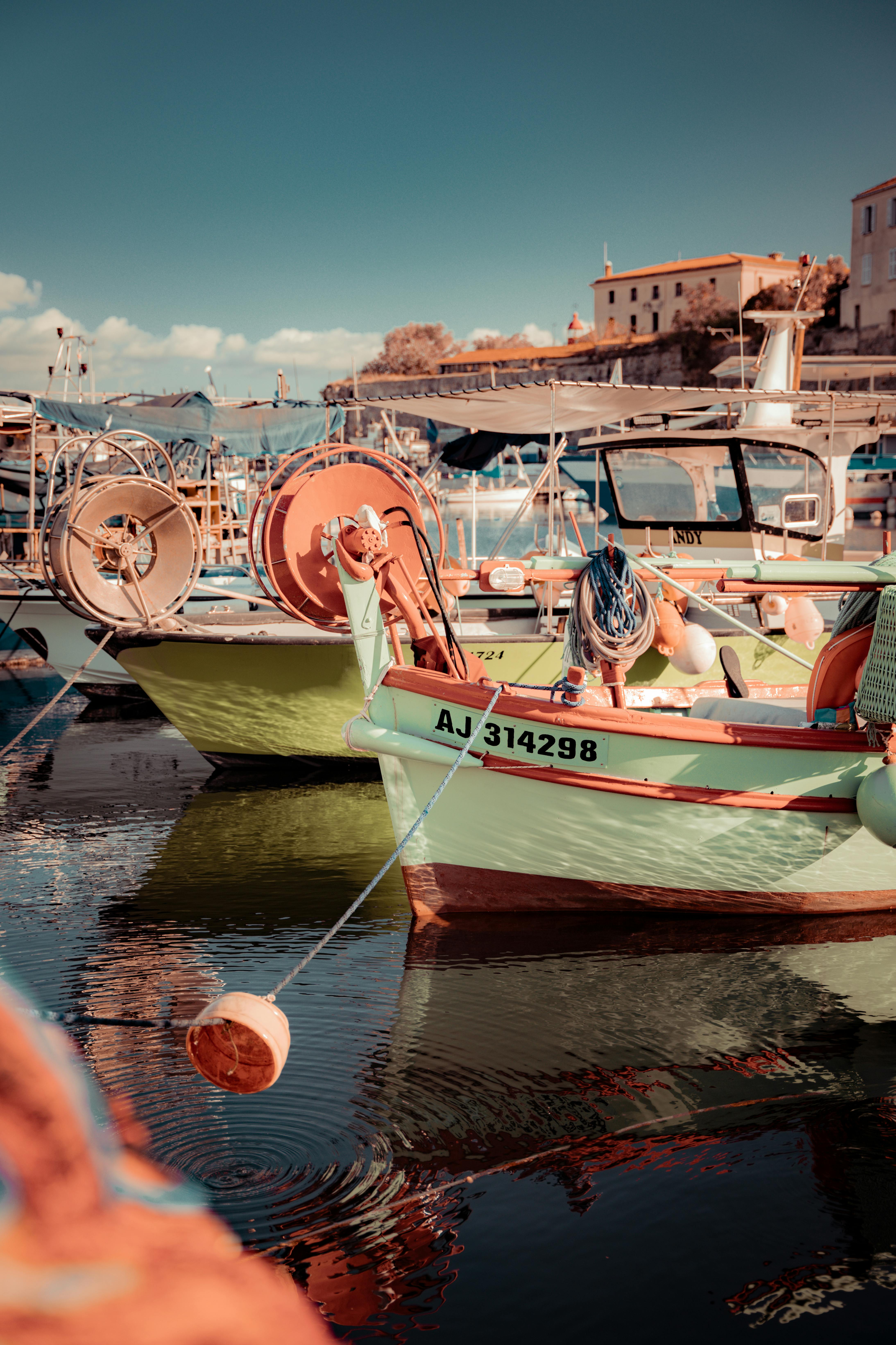 Boats on sea shore in town
