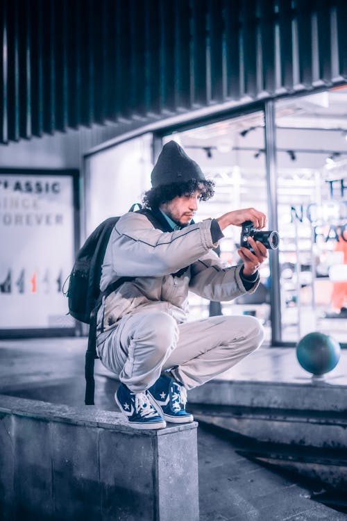 Man Taking Pictures with Camera