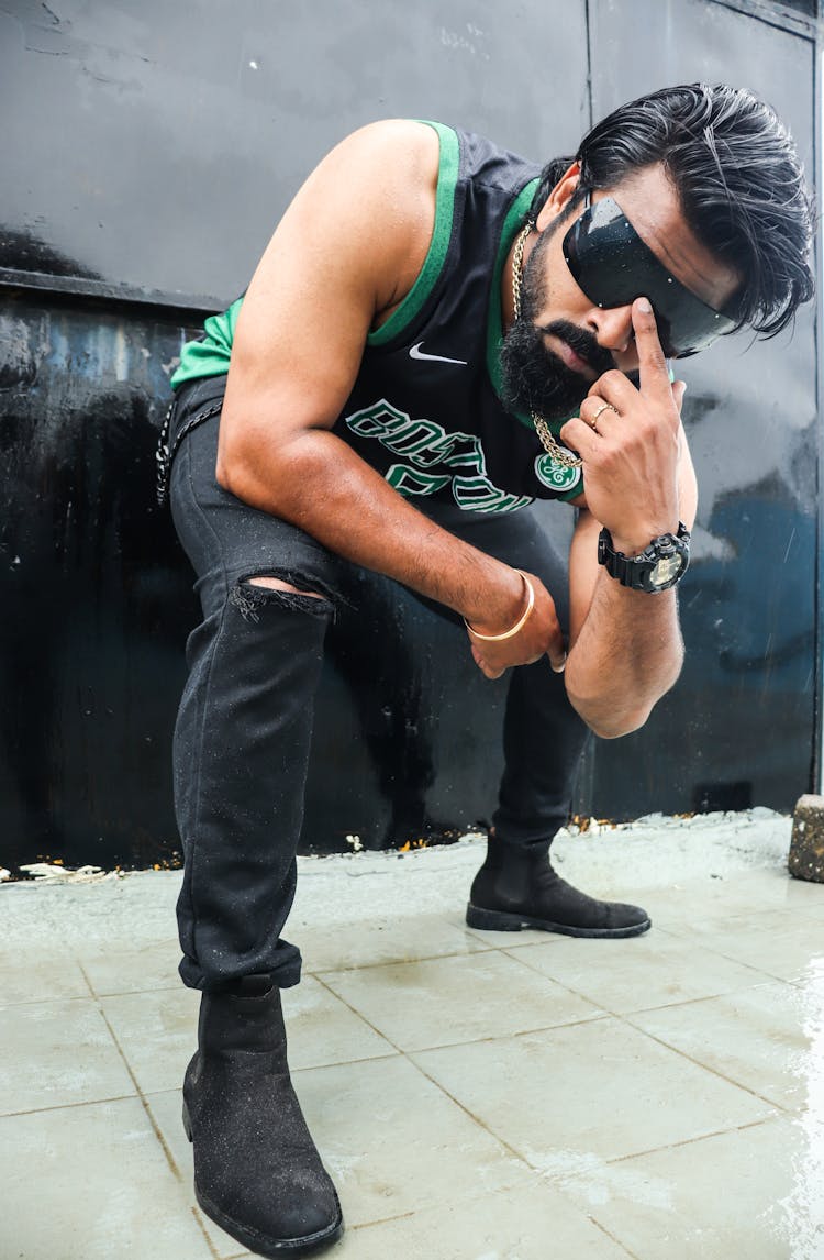 Man Squatting In Boston Celtics Tank Top