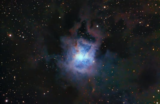 Vivid capture of the NGC 7023 Iris Nebula, surrounded by stars and cosmic dust.