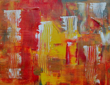 这幅抽象画色彩缤纷，笔触以鲜艳的红色、橙色和黄色为主