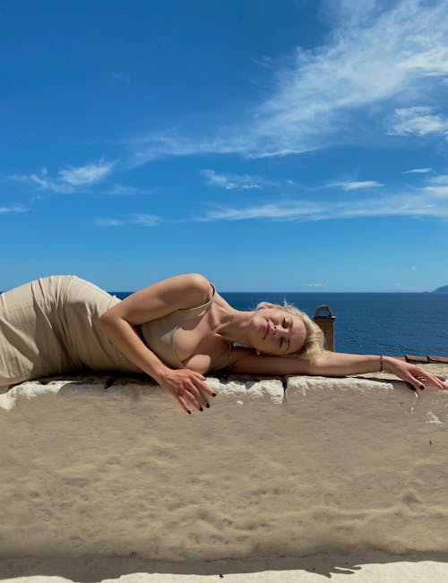 Blonde in Sepia Dress Posing at Beach
