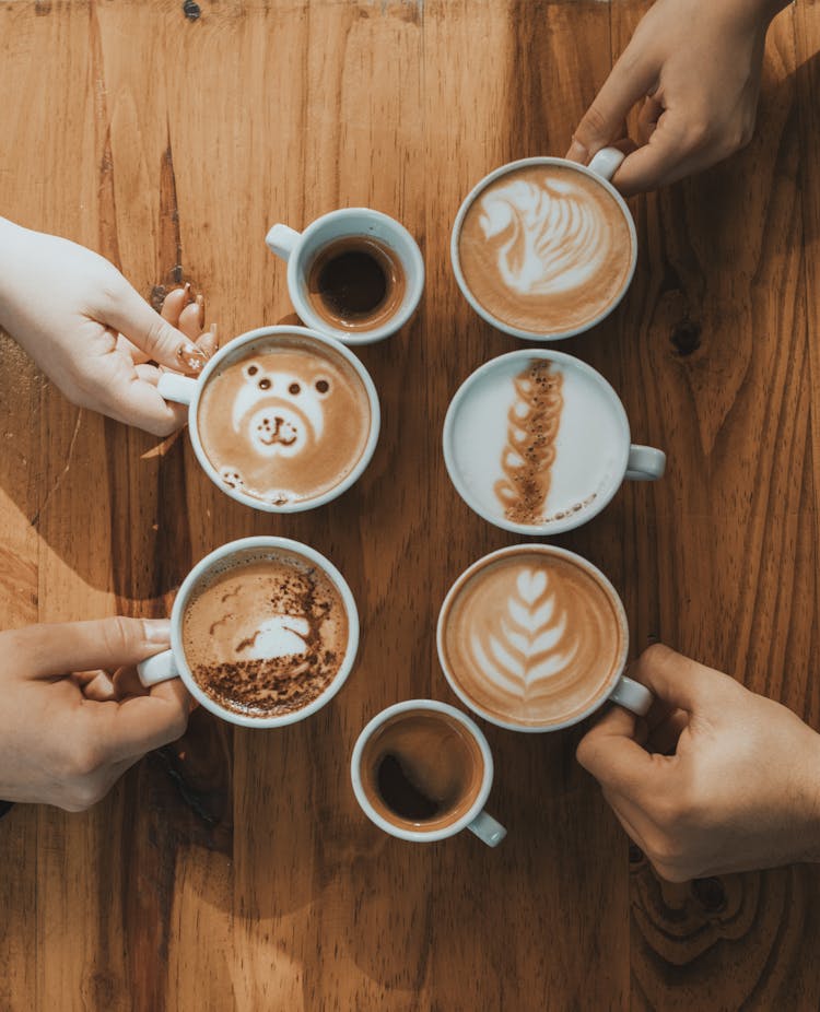 People Hands Holding Coffee Cups