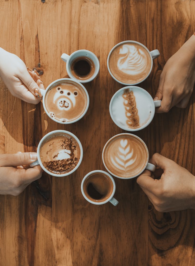 People Hands Holding Coffee Cups