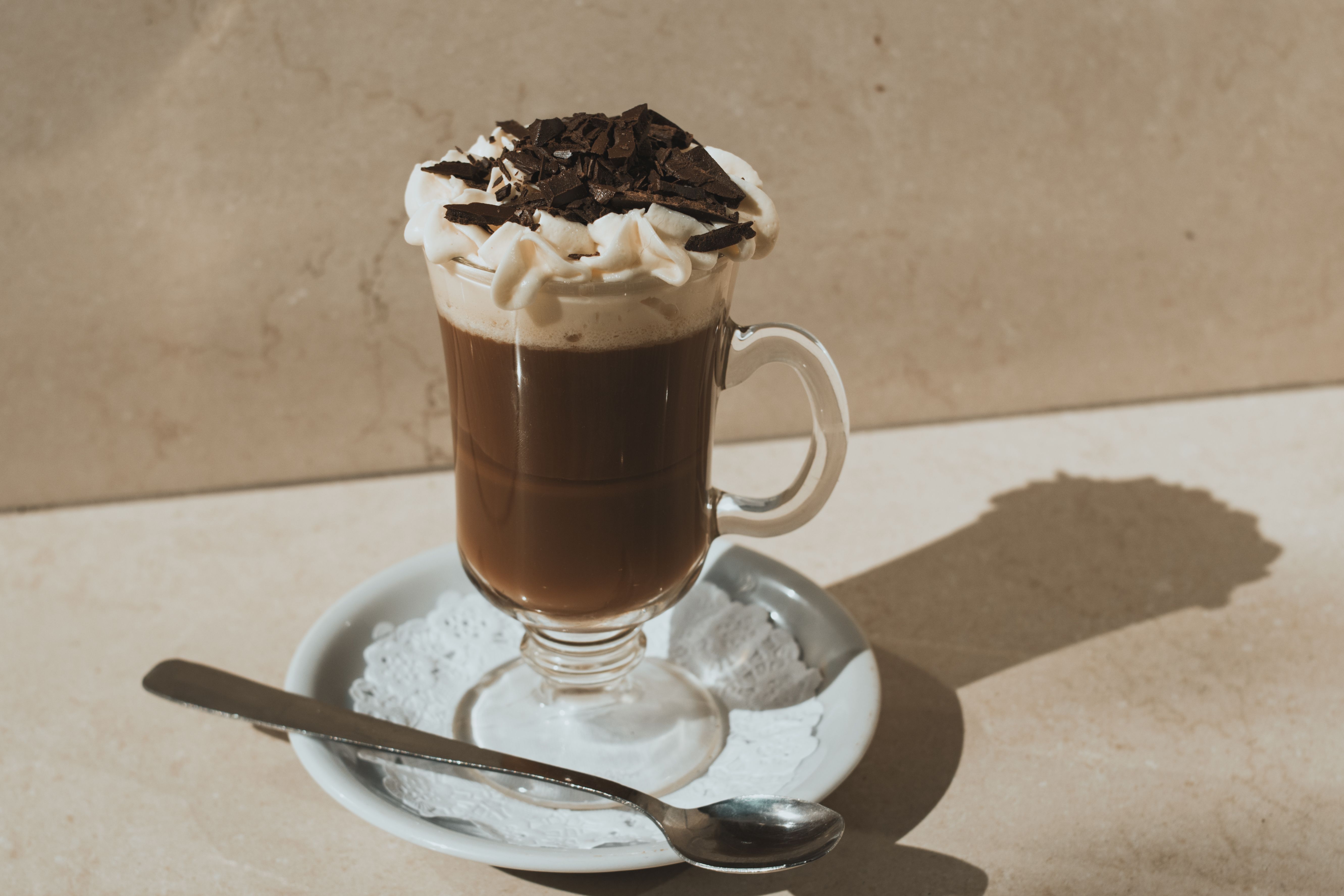 Einspanner Viennese coffee with dense whipped cream layer on espresso