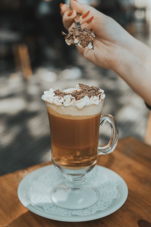 Free Woman Hand over Glass of Coffee Stock Photo