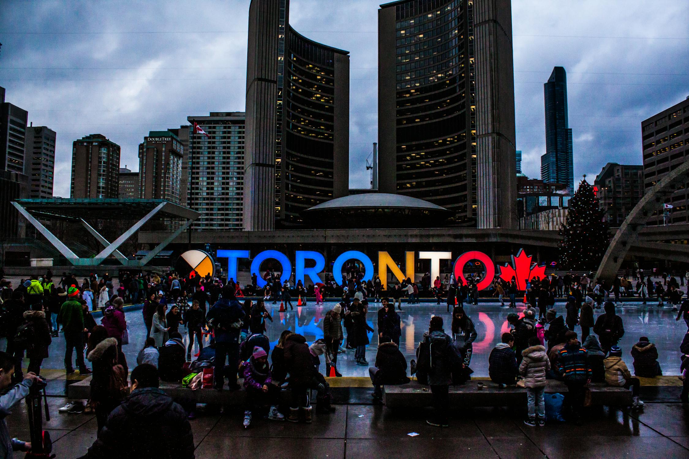 People gathered in front of a building in Toronto 