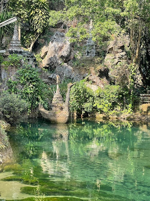 Ancient boat statue by the pool