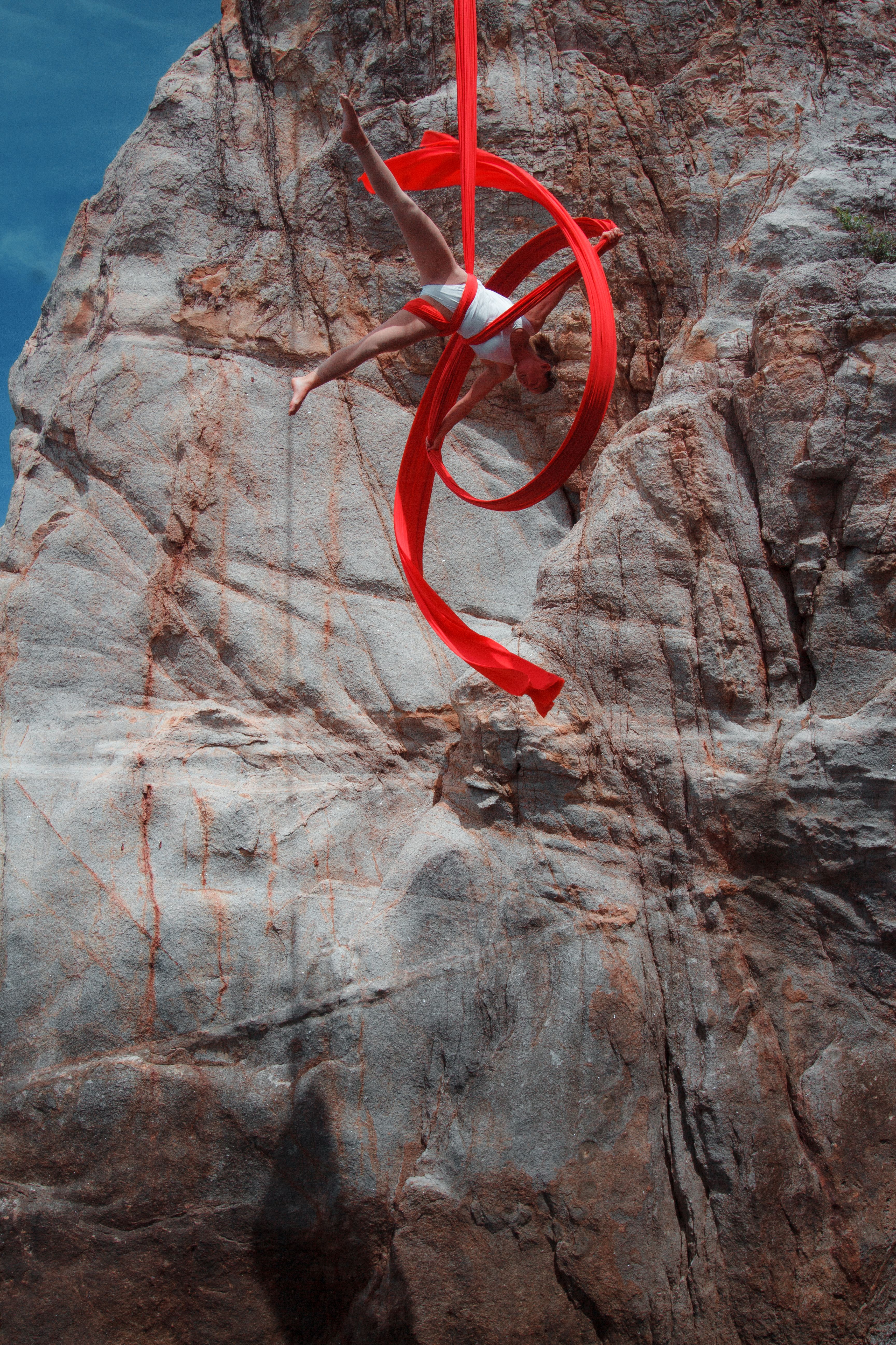 A red ribbon hanging from a rock · Free Stock Photo