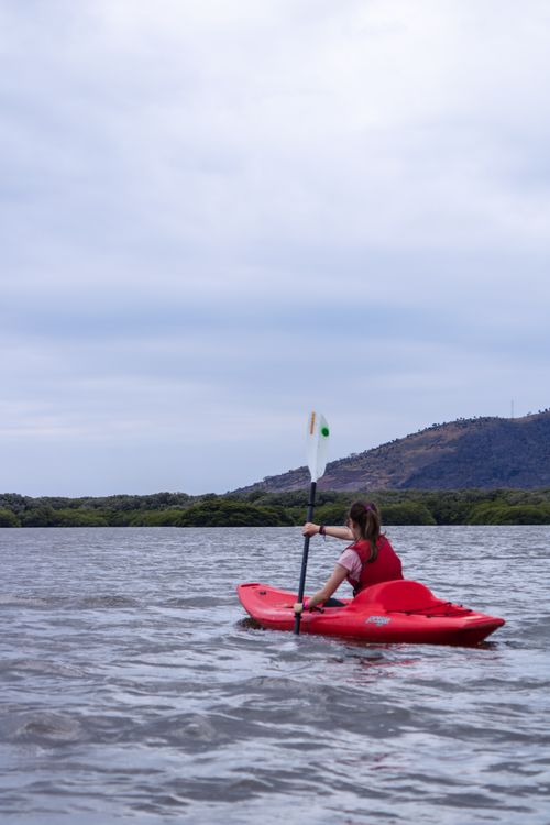 Free A woman enjoying a kayaking adventure on a tranquil lake surrounded by nature in Xalapa, Mexico. Stock Photo