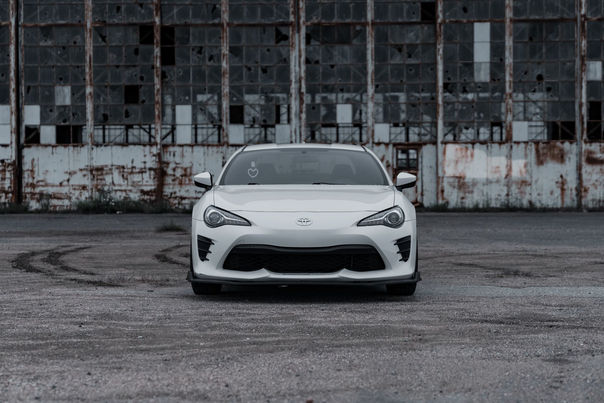 White Toyota 86 With Tsurikawa Ring Parked near Abandoned Factory Building