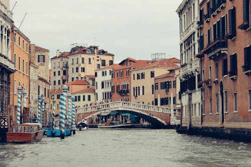 View of the Canal, Bridge and Residential Buildings in Venice, Italy 