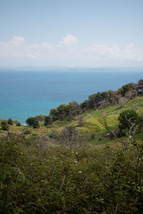 Free Beautiful view of Vlorë County in Albania with lush hills and a clear blue sea. Stock Photo