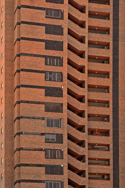 Free Close-up of a modern brick skyscraper facade in Benidorm, Spain, showcasing intricate geometric design. Stock Photo