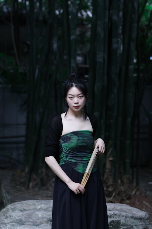 Standing Woman Holding Fan