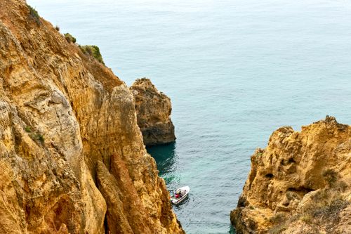 Free Explore the stunning cliffs and serene ocean near Lagos, Portugal, perfect for travel inspiration. Stock Photo