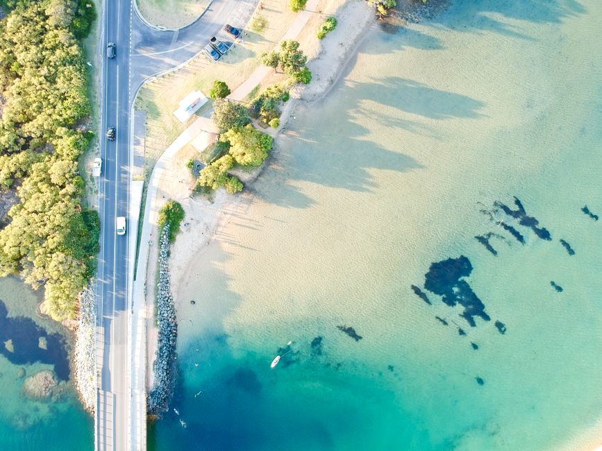 25-Minute Uluru and Kata Tjuta Scenic Helicopter Flight - Scenic aerial view of Kingscliff coastline with road and ocean in NSW, Australia.