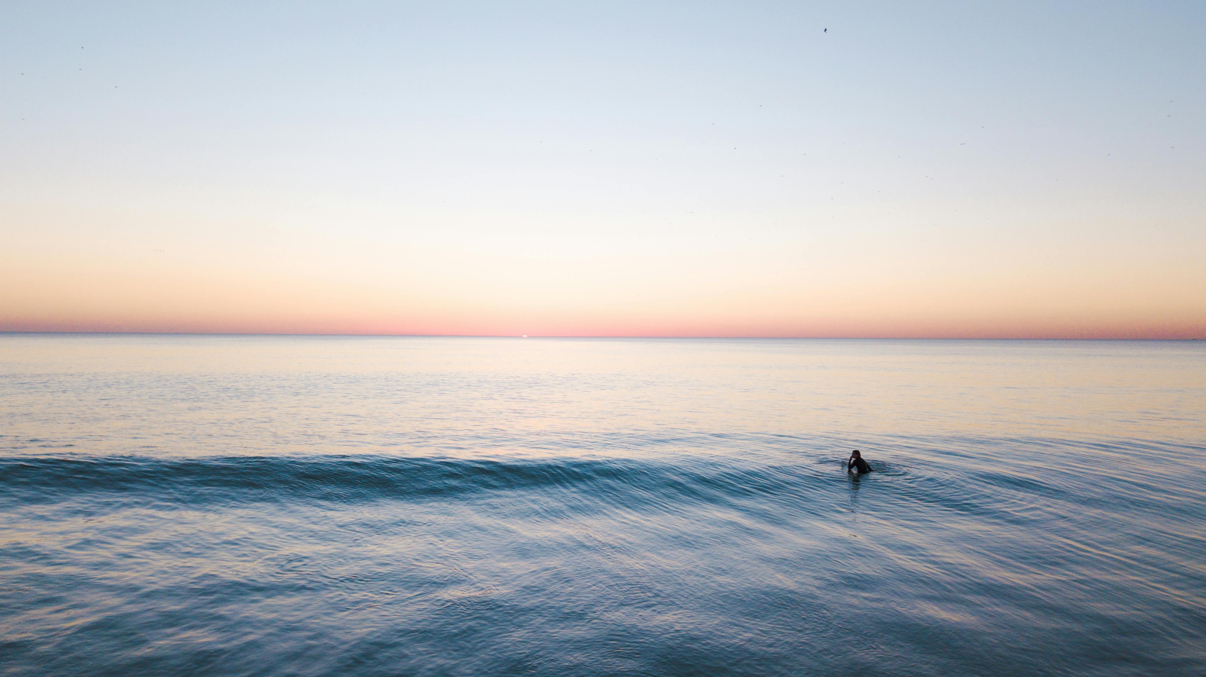 person swimming in the sea