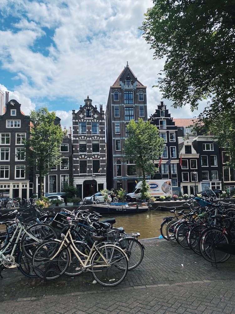 Bikes Near Canal In Amsterdam