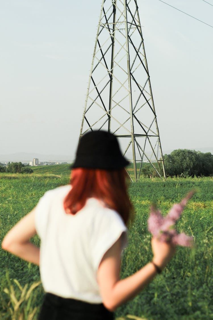 Woman Standing In The Meadow