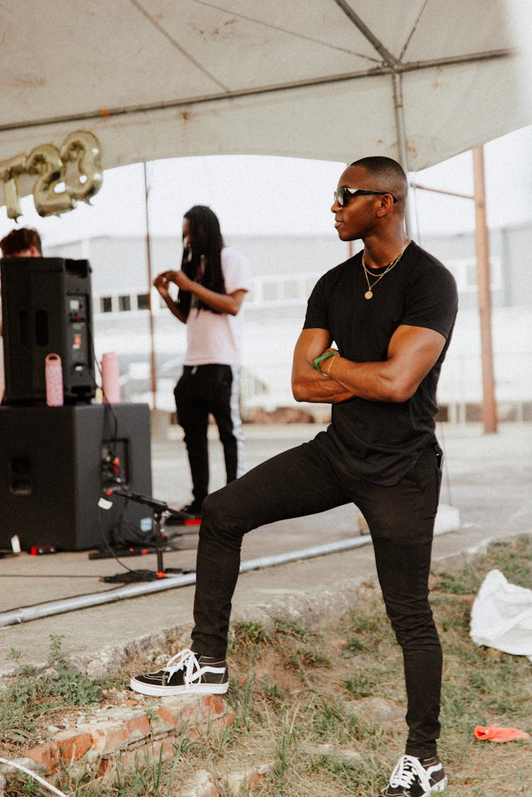 Man Standing Near Concert Stage