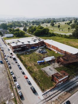 Drone shot capturing a vibrant outdoor event in an urban area of Chattanooga, TN.