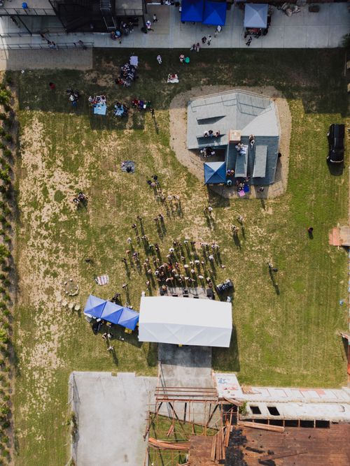 Free Aerial shot of a community event in Chattanooga, showcasing people and tents. Stock Photo