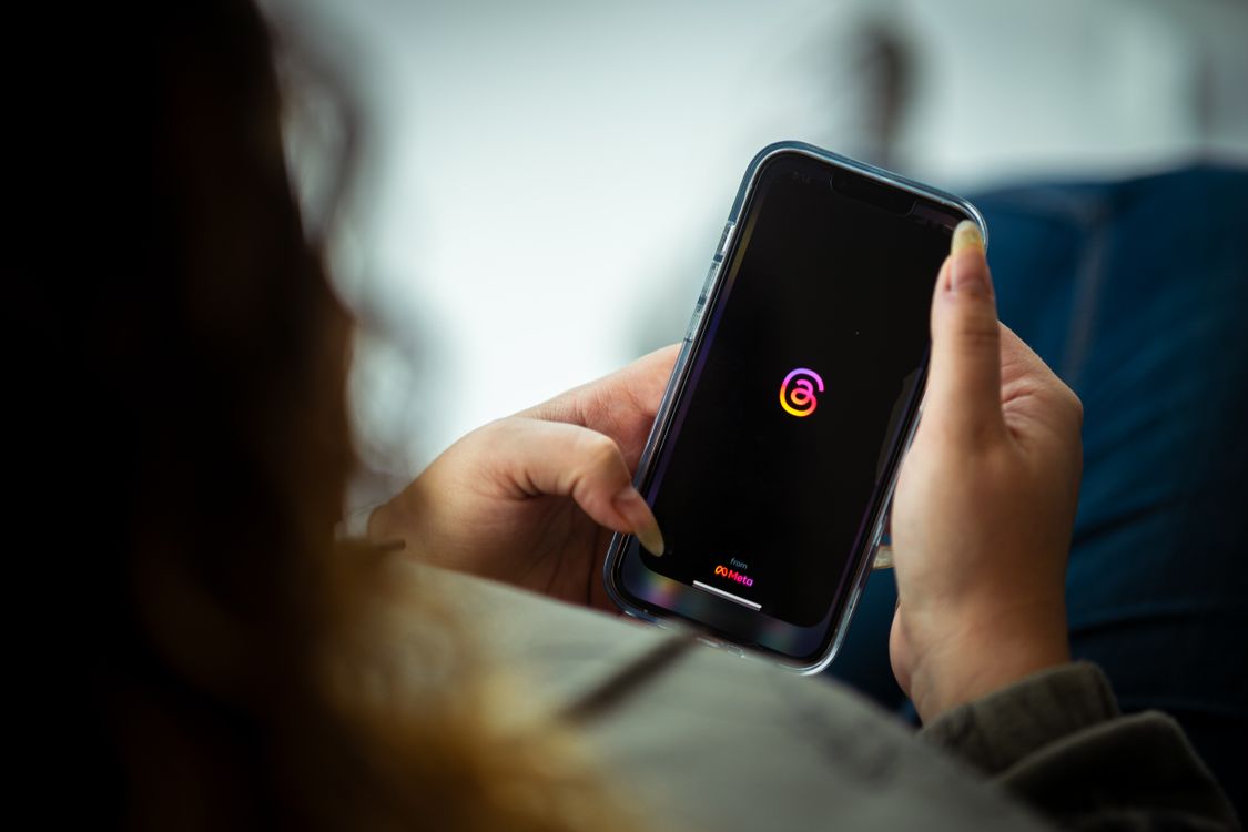A person looking at a smartphone screen while holding the device