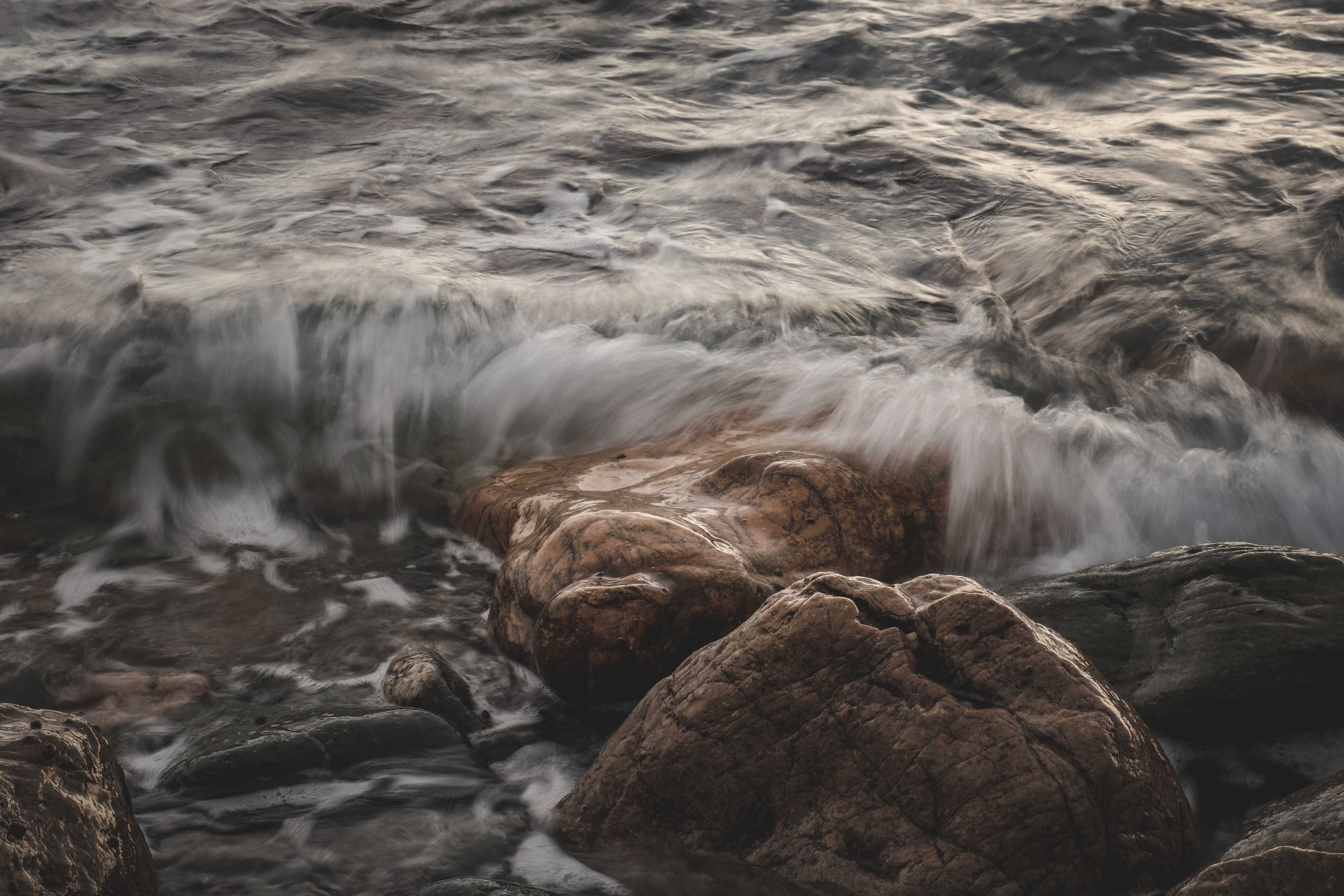 Blurred Motion of Flowing Water over Rocks · Free Stock Photo
