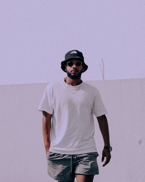 Model in a Black Bucket Hat White T-shirt and Gray Shorts