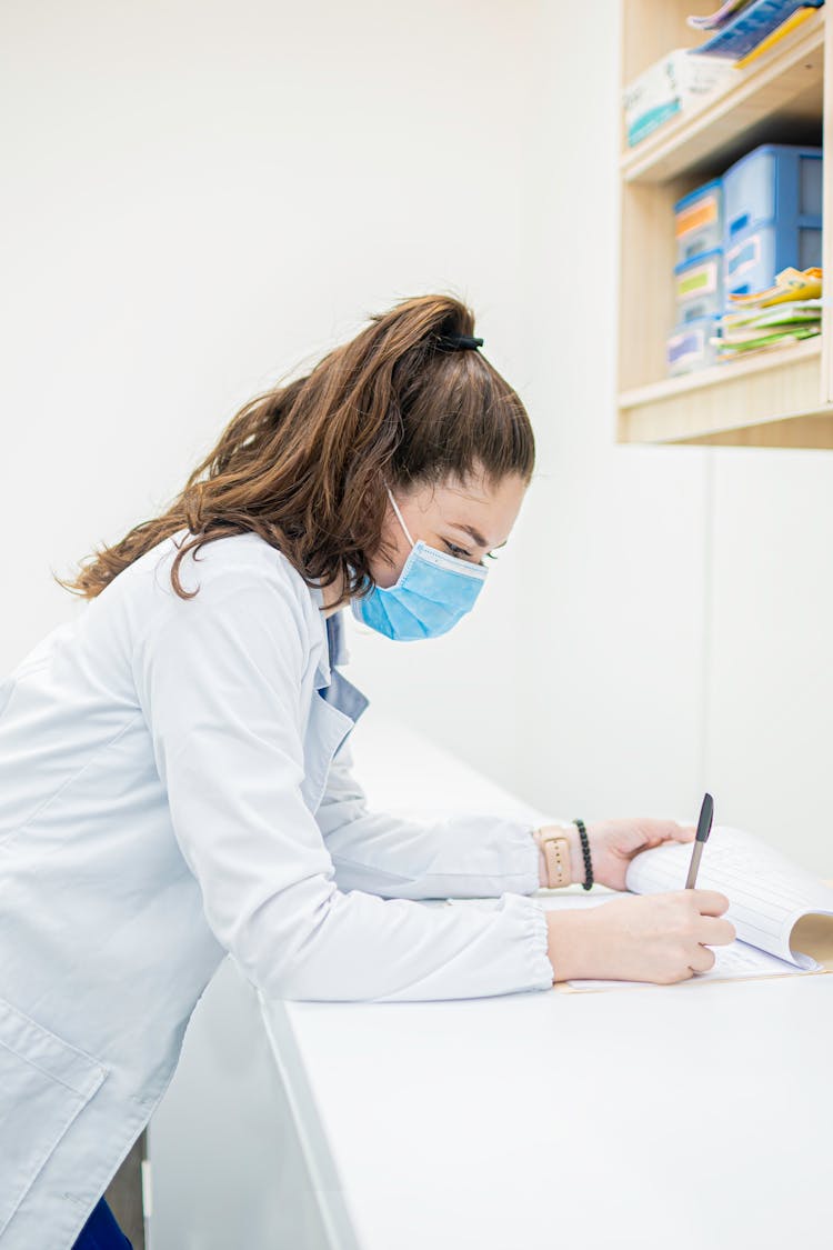 Doctor Filling Documents