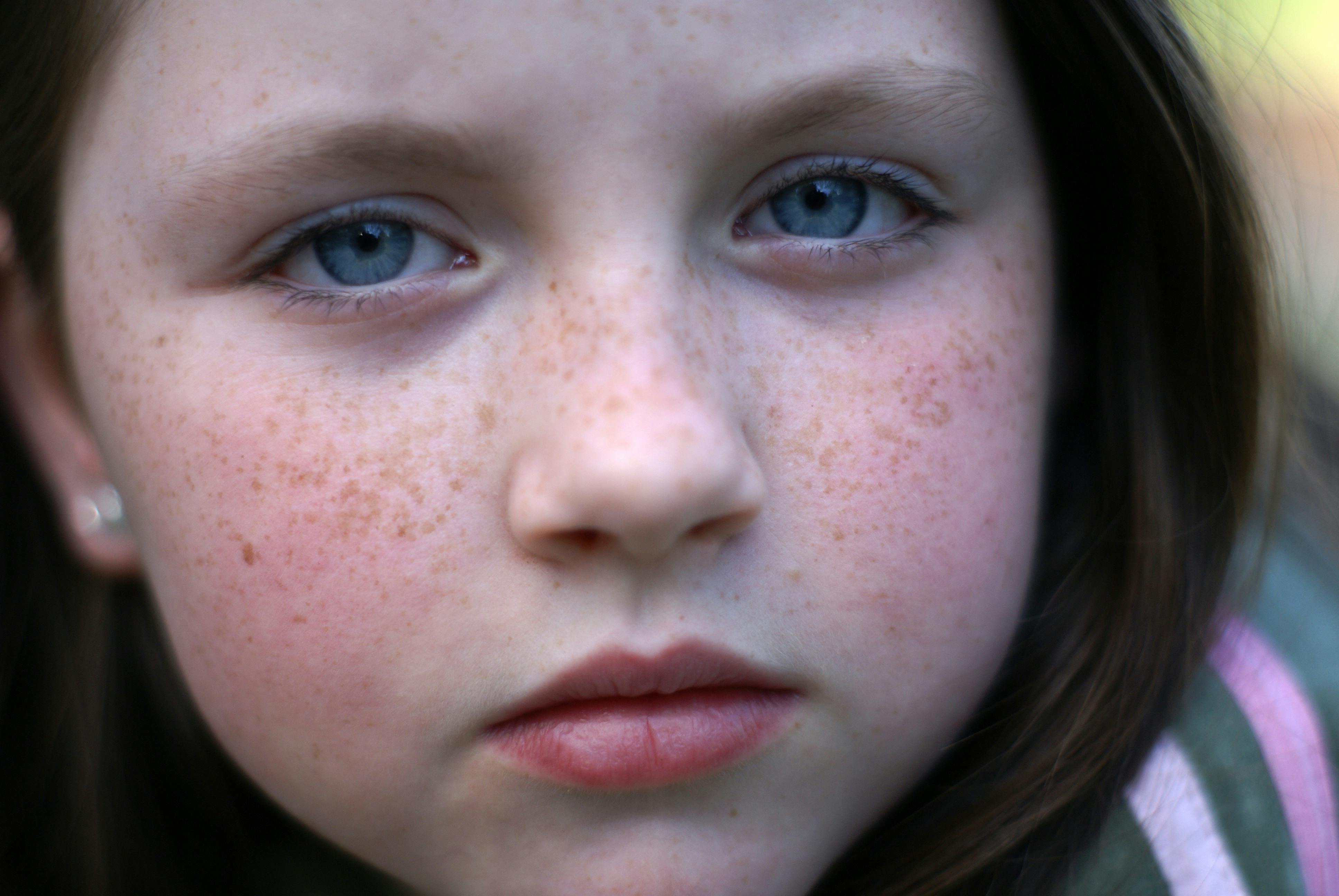 A close up of a young girl with freckles · Free Stock Photo