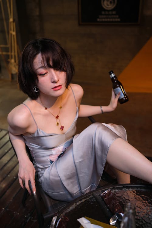 Drunk Woman with Bottle of Beer