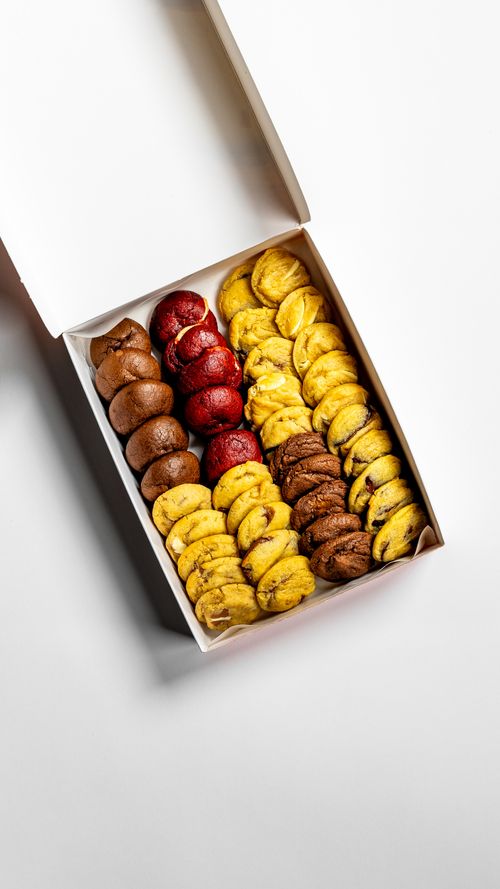 Free An assortment of delicious cookies in a box presented from a top view on a white background. Stock Photo