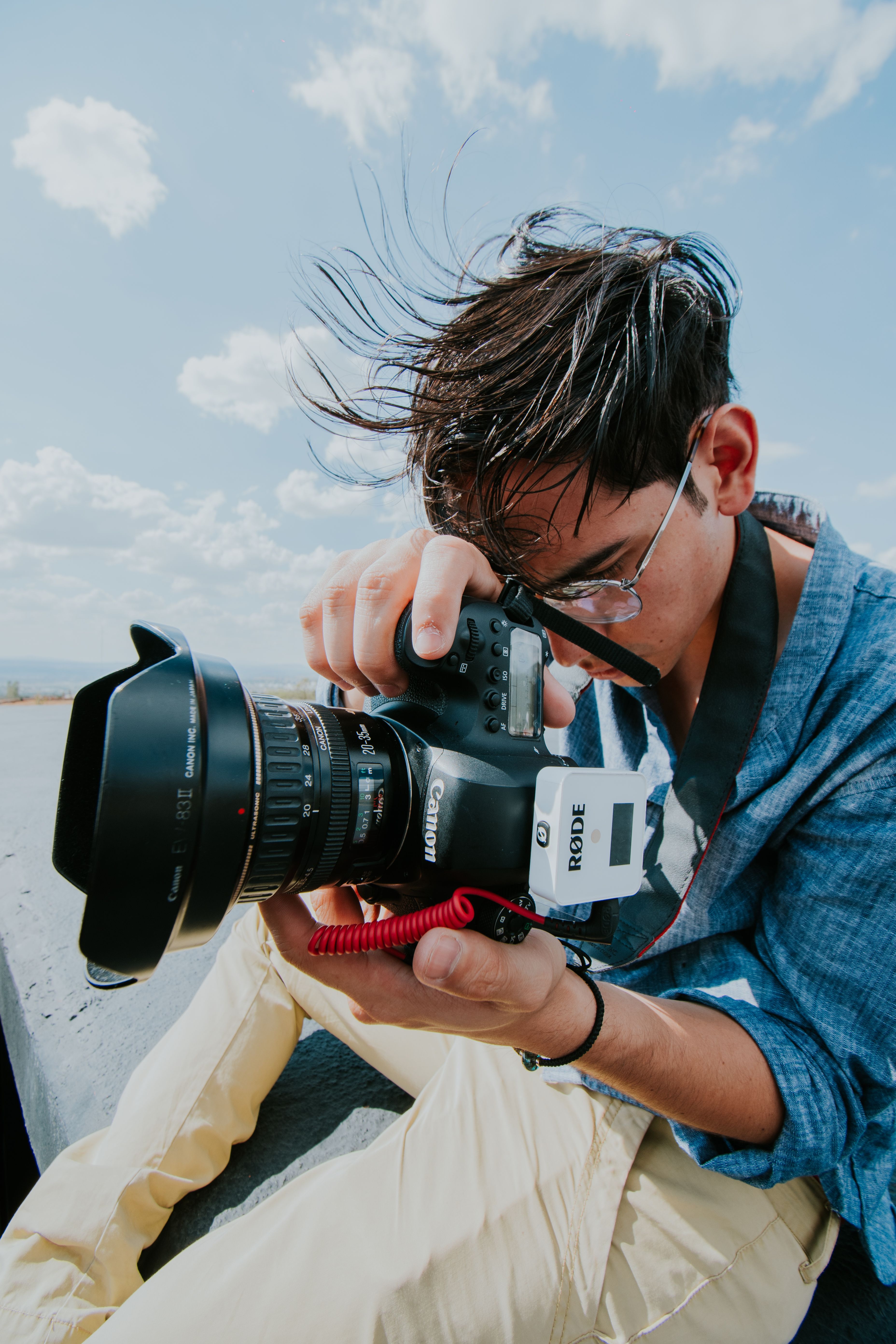 Photographer Using a Camera · Free Stock Photo