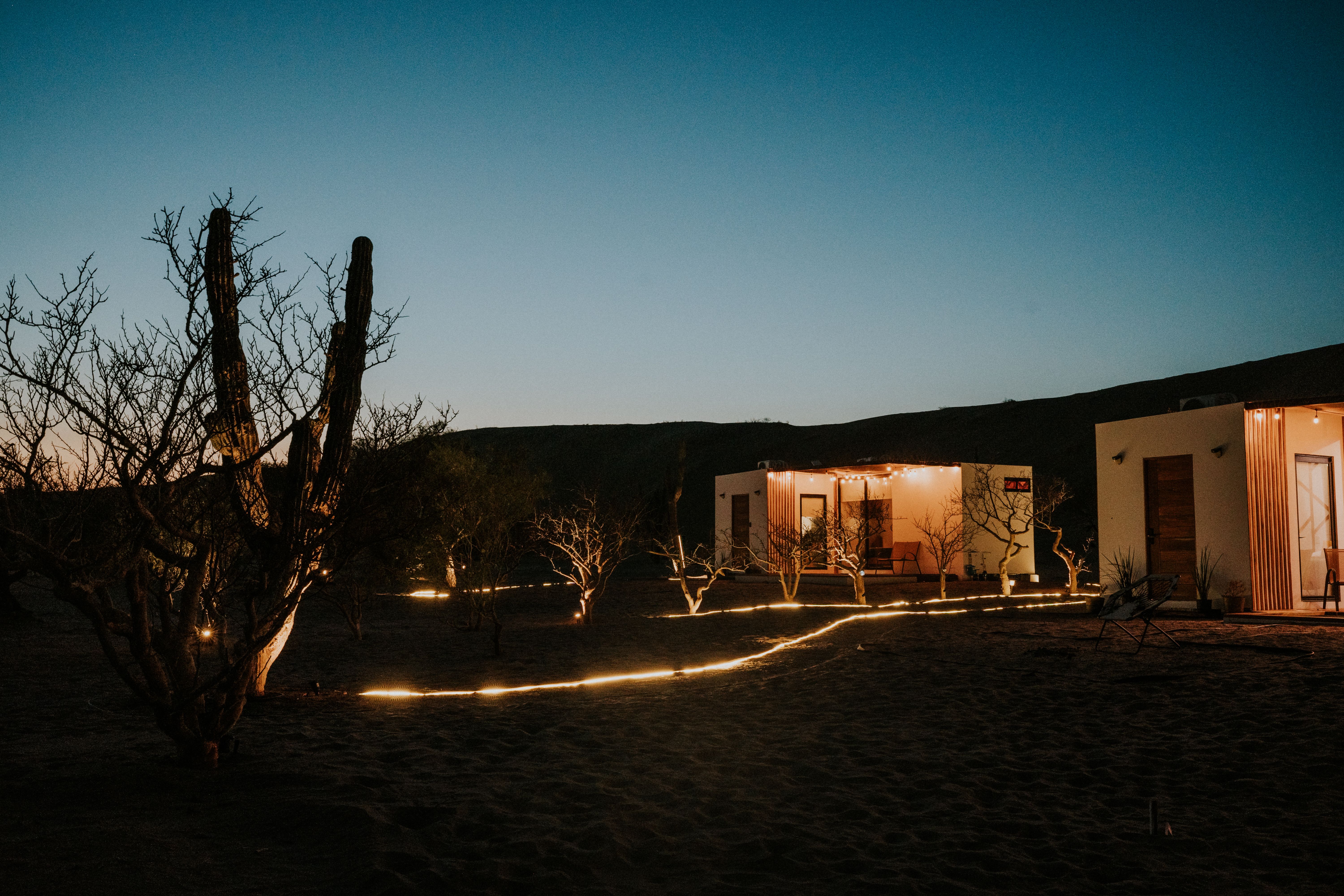 A serene view of an ultra-luxury private retreat at twilight, emphasizing silence and architectural elegance.