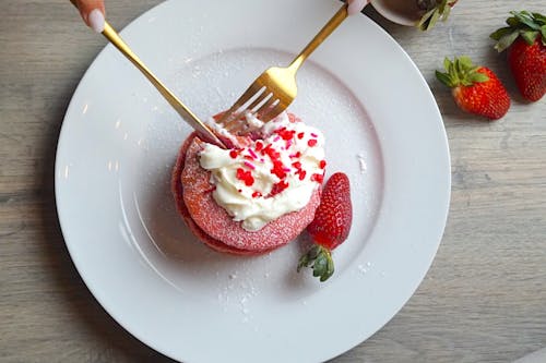 Dessert with Whipped Cream and a Strawberry