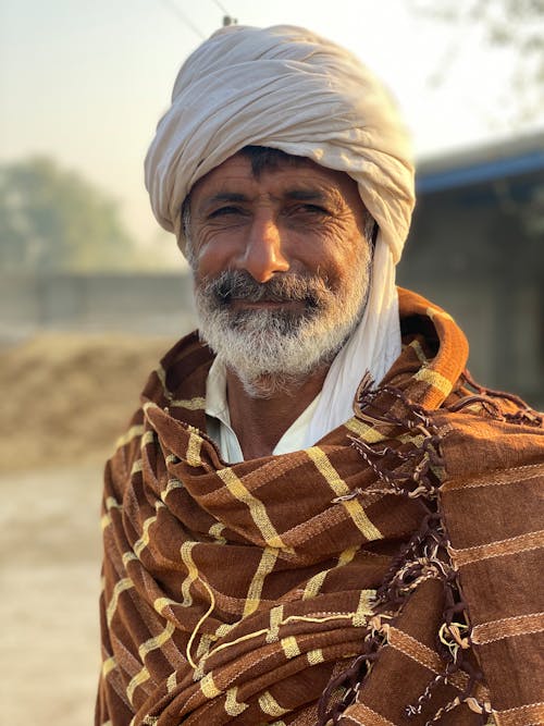 Portrait of an Elderly Man in Traditional Clothing 