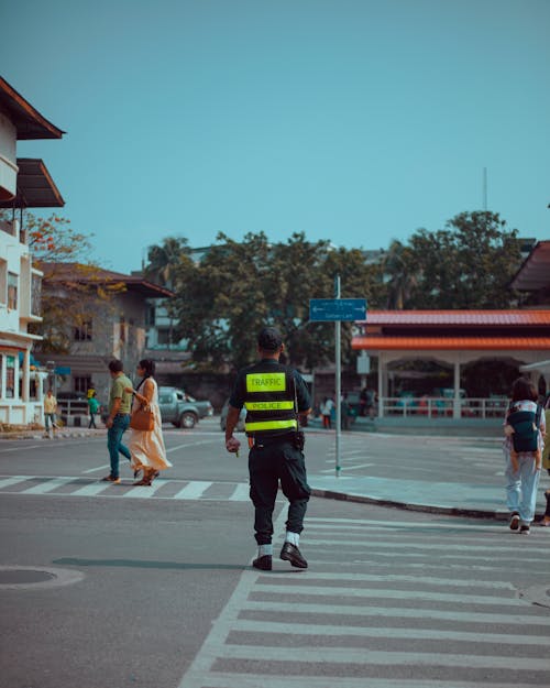Traffic Police Officer Crossing the Street 