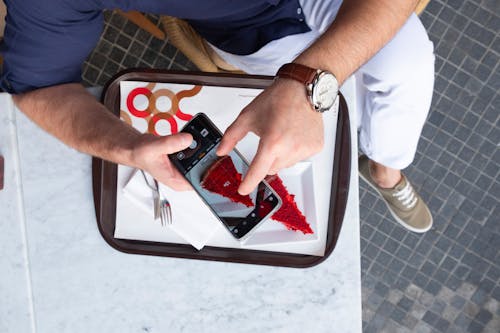 Free Top View Photo of Person Taking Picture Stock Photo