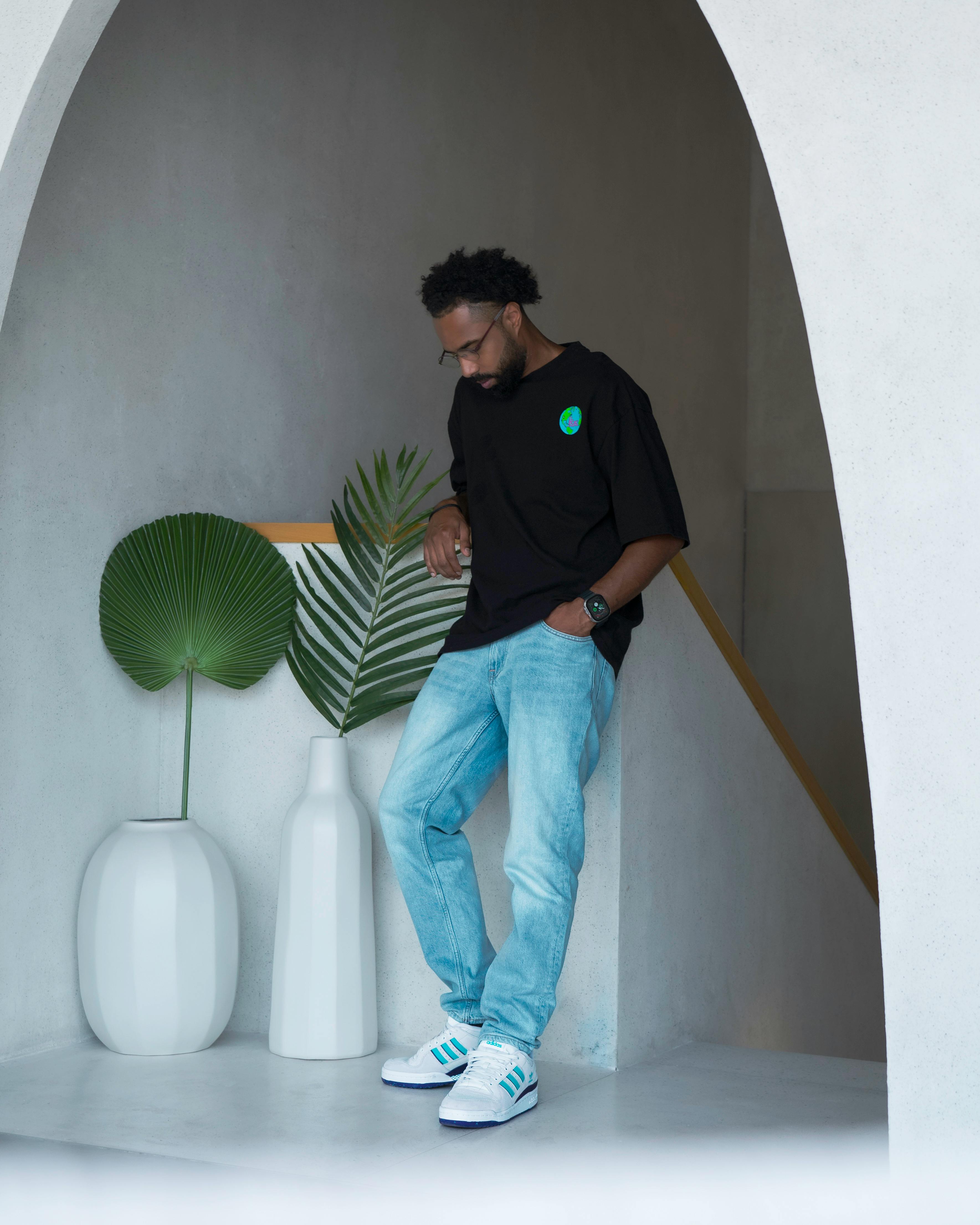 young man in a casual outfit standing in a modern interior