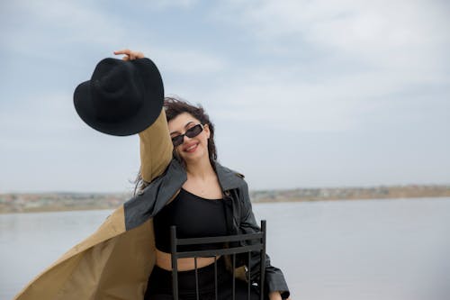 Smiling Woman with Hat and in Sunglasses