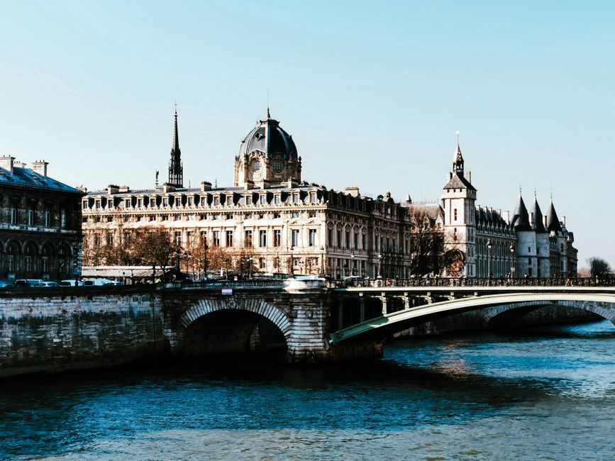 Stunning view of the Pont au Change and La Conciergerie on the Seine River in Paris, France.