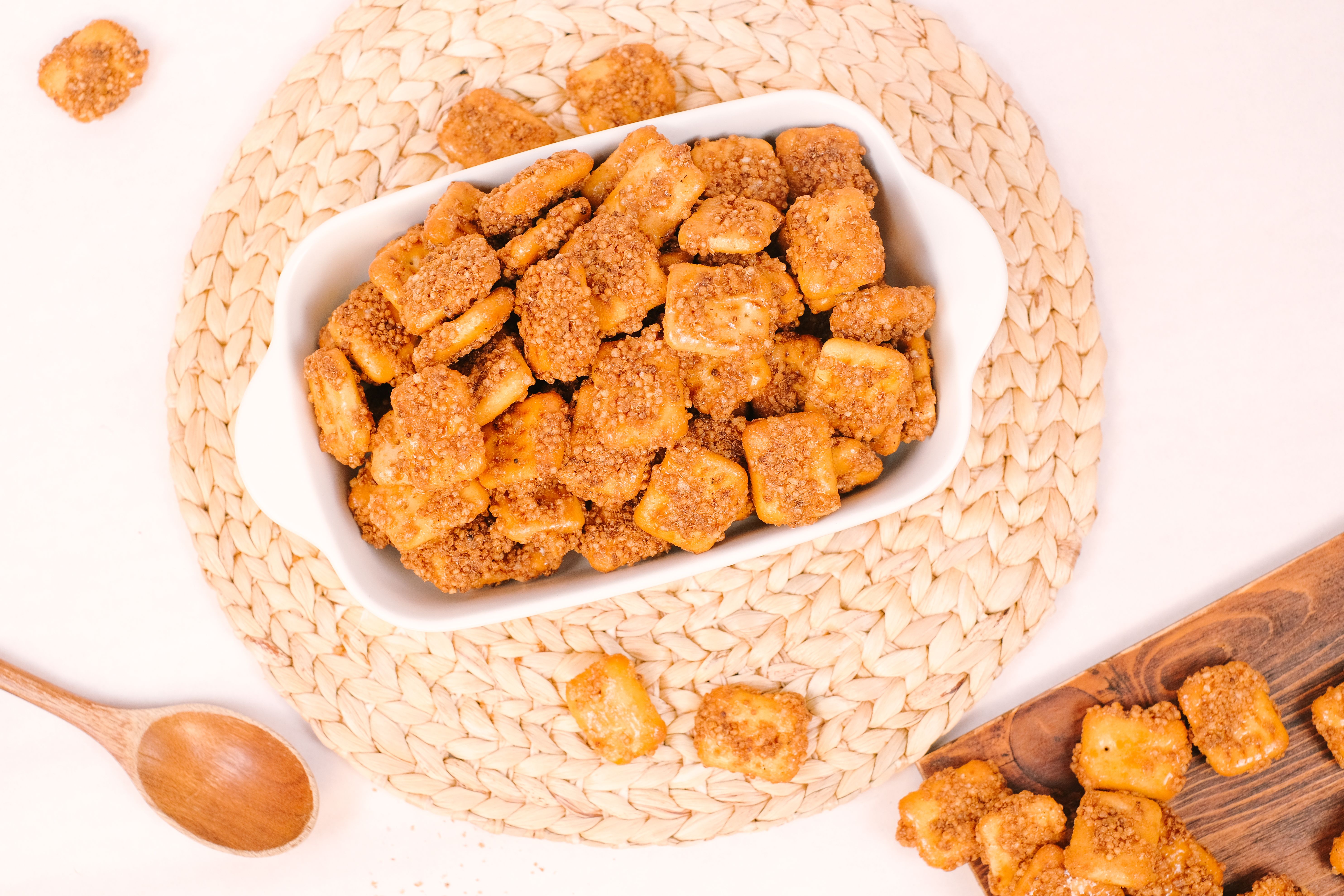 High-angle view of crunchy cinnamon square cereal in a bowl, perfect for breakfast or snack.