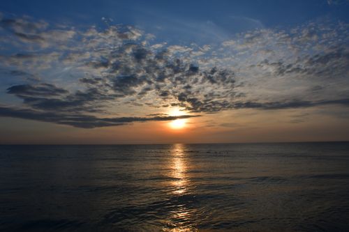 Free Beautiful sunset with clouds reflecting over the Quy Nhon sea. Stock Photo