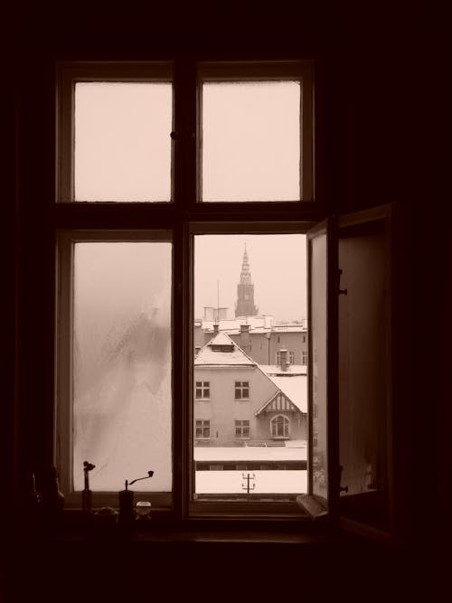 Buildings and Church Tower behind Windows