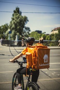A food delivery cyclist with backpack on city streets, showcasing modern urban life.