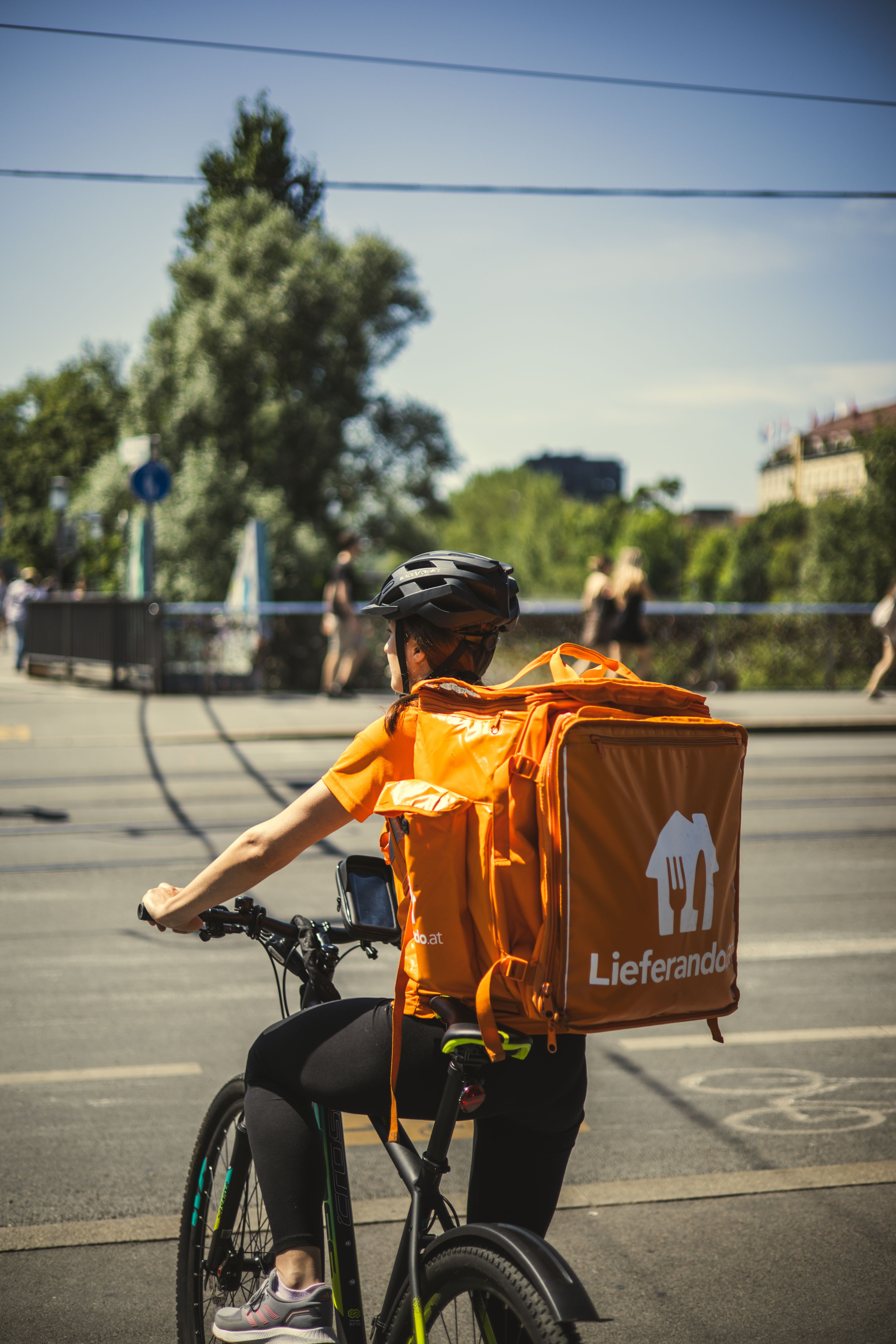 Food Delivery Driver on Bicycle · Free Stock Photo
