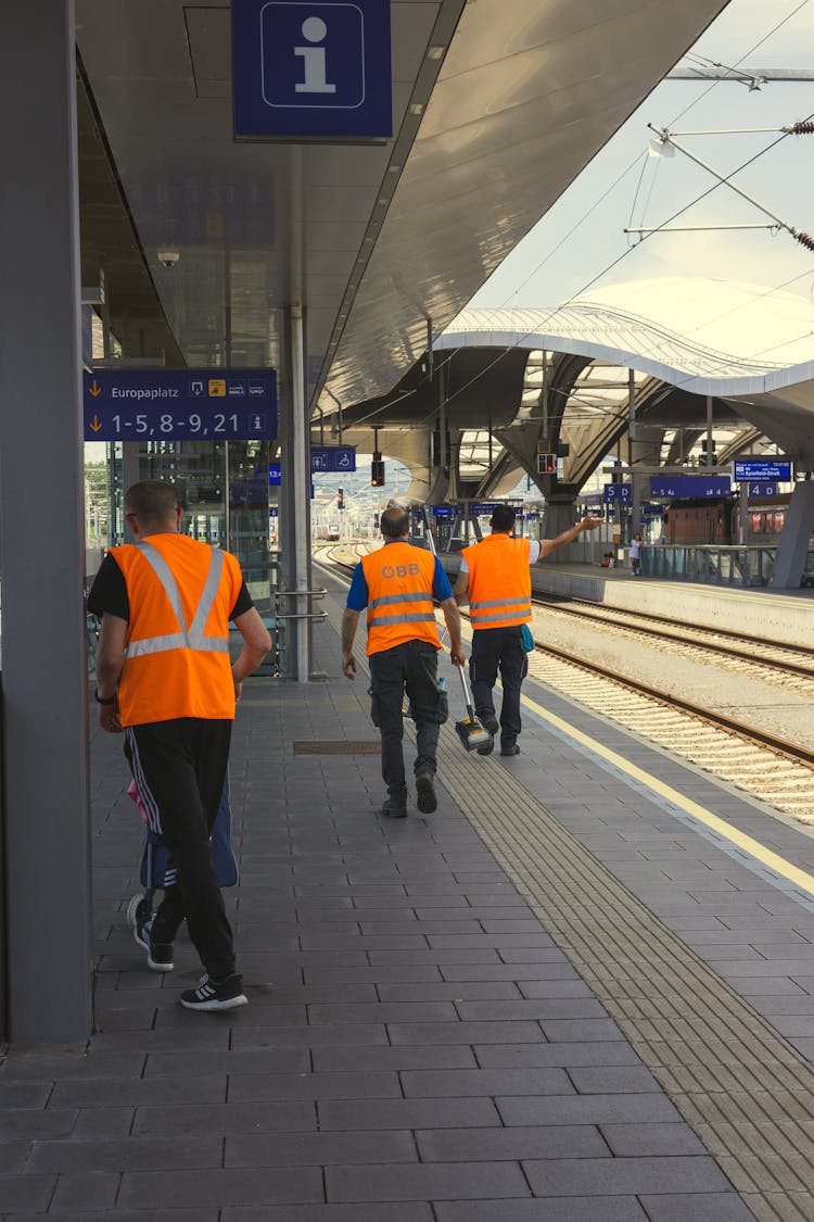 Workers On Train Station